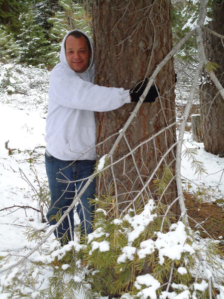 Jim Herrington warms up to Lodgepole pine along the trail at Lake Tahoe.