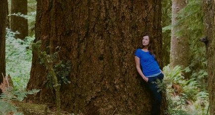 Cascadia Wildlands Executive Director Kate Ritley strikes a pose in the Elliott Rainforest, near Eugene, Oregon.