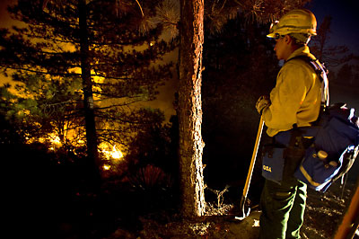 Lonely watch on the fire line (photo courtesy of San Gabriel Valley Newspaper Group / © 2009 photographer Eric Reed).