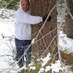Jim Herrington warms up to Lodgepole pine along the trail at Lake Tahoe.